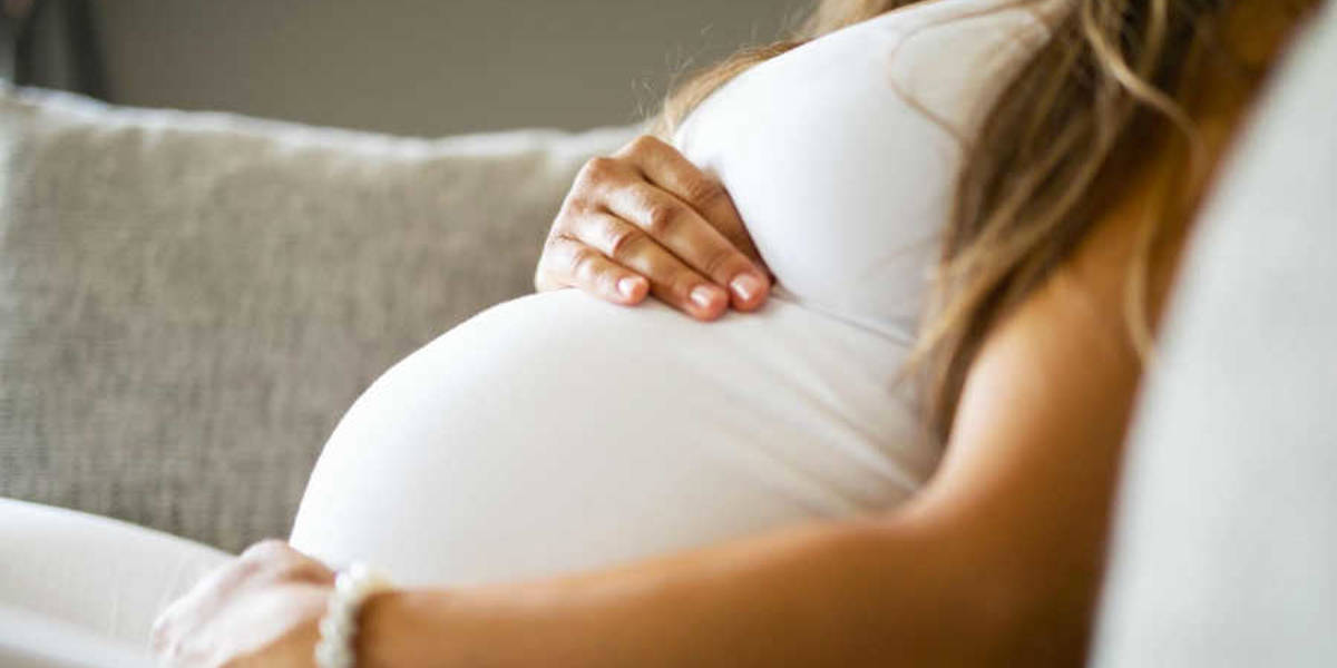 Pregnant Woman Holding Stomach